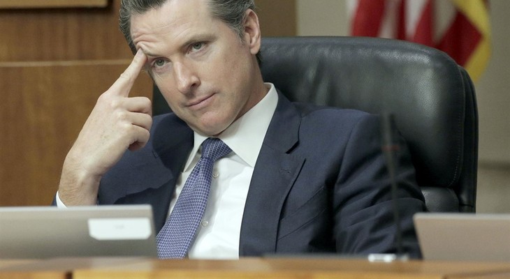 FILE - In this Nov. 17, 2015 file photo, California Lt. Gov. Gavin Newsom listens during a California State University trustees meeting in Long Beach, Calif. The University of Californi